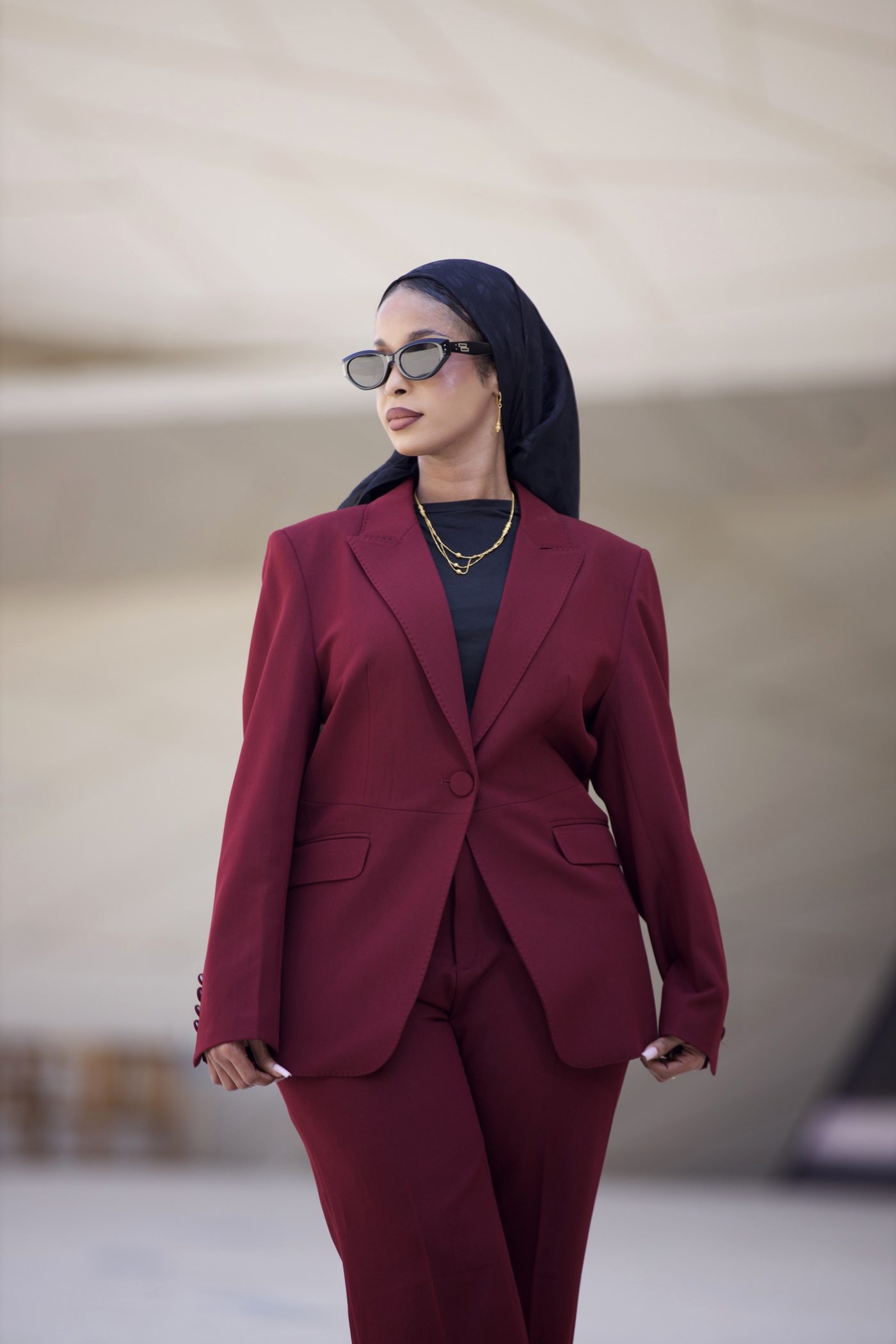 Close portrait in a wine suit and sunglasses